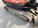 a small excavator that is sitting on the ground