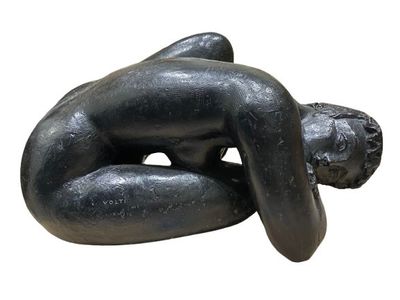 sculpture of a woman laying on her back on a white background