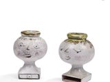 pair of antique cast iron heads of a boy and a girl