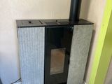 a small stove in the corner of a room