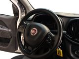 a steering wheel and dashboard of a car with a yellow tag on it