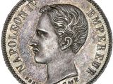 une pièce d'argent sur laquelle figure la tête d'un homme coiffée d'une couronne