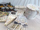 a lot of party supplies on a table with a white table cloth