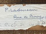 a piece of paper that has been written on a piece of wood