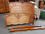 an image of a bed with a wooden headboard and foot board