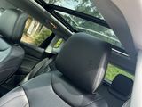two seats in the back of a car that are black and gray