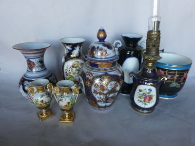 many different types of vases sitting on a table