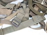 a pile of military gear on a white surface