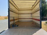 the back end of a moving truck with the door open