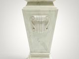 an image of a white marble vase with a face on it