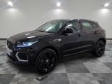 a black 2020 jaguar pace pace is parked in a garage