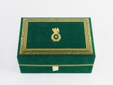 an image of a green box with gold trimming and a gold letter s on it