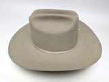the hat is tan and has a white band around the brim
