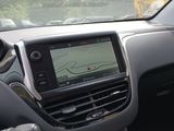 the dashboard of a car with a gps device in it