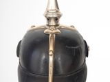 a black helmet with a gold decoration on the top