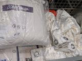 a large bag of bedding sitting on a shelf in a store