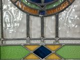 a stained glass window with a star in the center