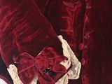 a red jacket with a white collar and a bow on it