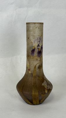 a vase that has been decorated with flowers on it