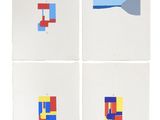 four different colored squares are arranged on a white surface