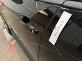 a sticker on the door of a car that has a sticker on it