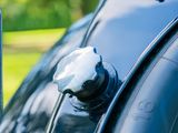 a close up of a car door handle with a key on it