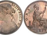 a close up of a coin with a woman on it
