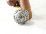 a close up of a baseball bat and a ball on a table