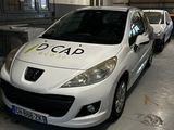 a white car parked in a garage with other cars