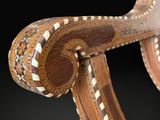 an image of a close up of a wooden object on a black background