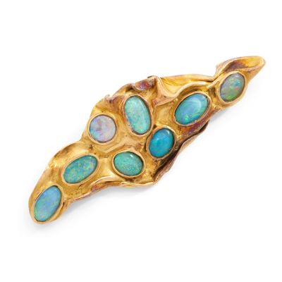 BROCHE de forme asymétrique texturée ornée de 8 opales.