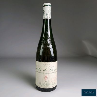 a bottle of wine that is sitting on a table