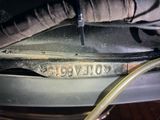 an image of a close up of a metal object with a hose attached to it