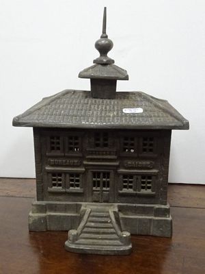 a small statue of a building with a steeple on top