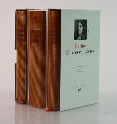 three books sitting on top of a table next to each other