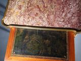 a picture of a table with a marble top on top of it