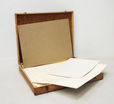 a small open box that has some papers inside of it