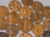 a lot of coins that are sitting on a table