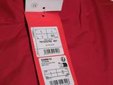 a close up of a red jacket with a price tag on it