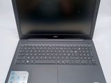 the dell laptop is open and ready to be used