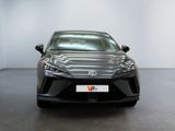 the front view of a black car in a white room