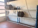 a garage with a lot of tires on the shelves