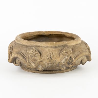 an image of a small bowl with figures on it
