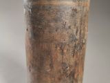 a vase that has a metal lid on it