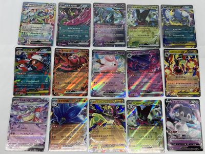 the pokemon cards are lined up on a white surface