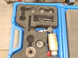 a blue case with tools in it sitting on a table