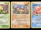 three pokemon cards are shown in a row on a black background