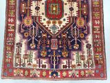 an old rug with many different colors and patterns on a white background