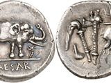 an image of a silver coin with an elephant and a cross on it
