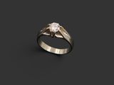 a white gold ring with a single diamond in the center